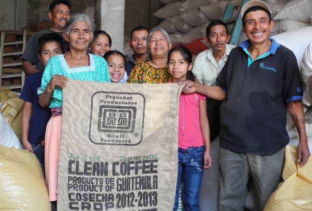 Members of Apecaform proudly display their first export sacks carrying the Small-Producer Symbol SPP